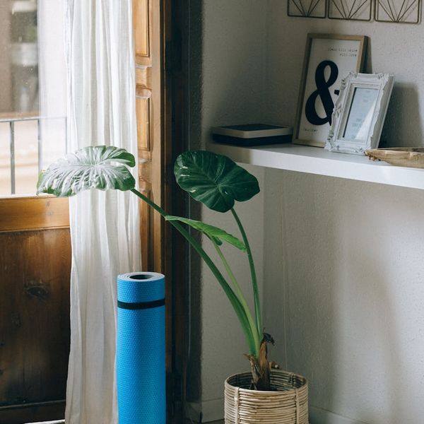 Serene view of a yoga mat near a window with soft light.